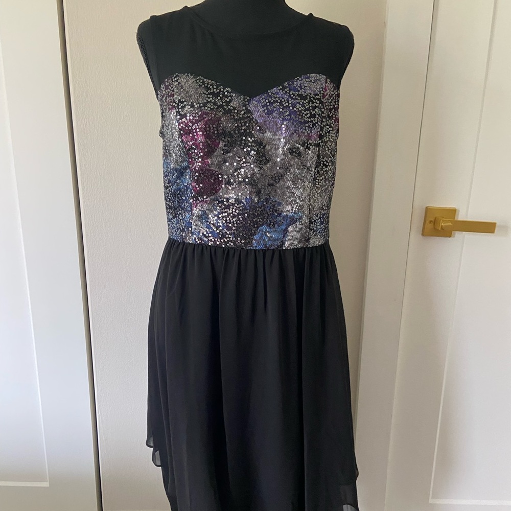 Beautiful black cocktail dress with metallic bodice.